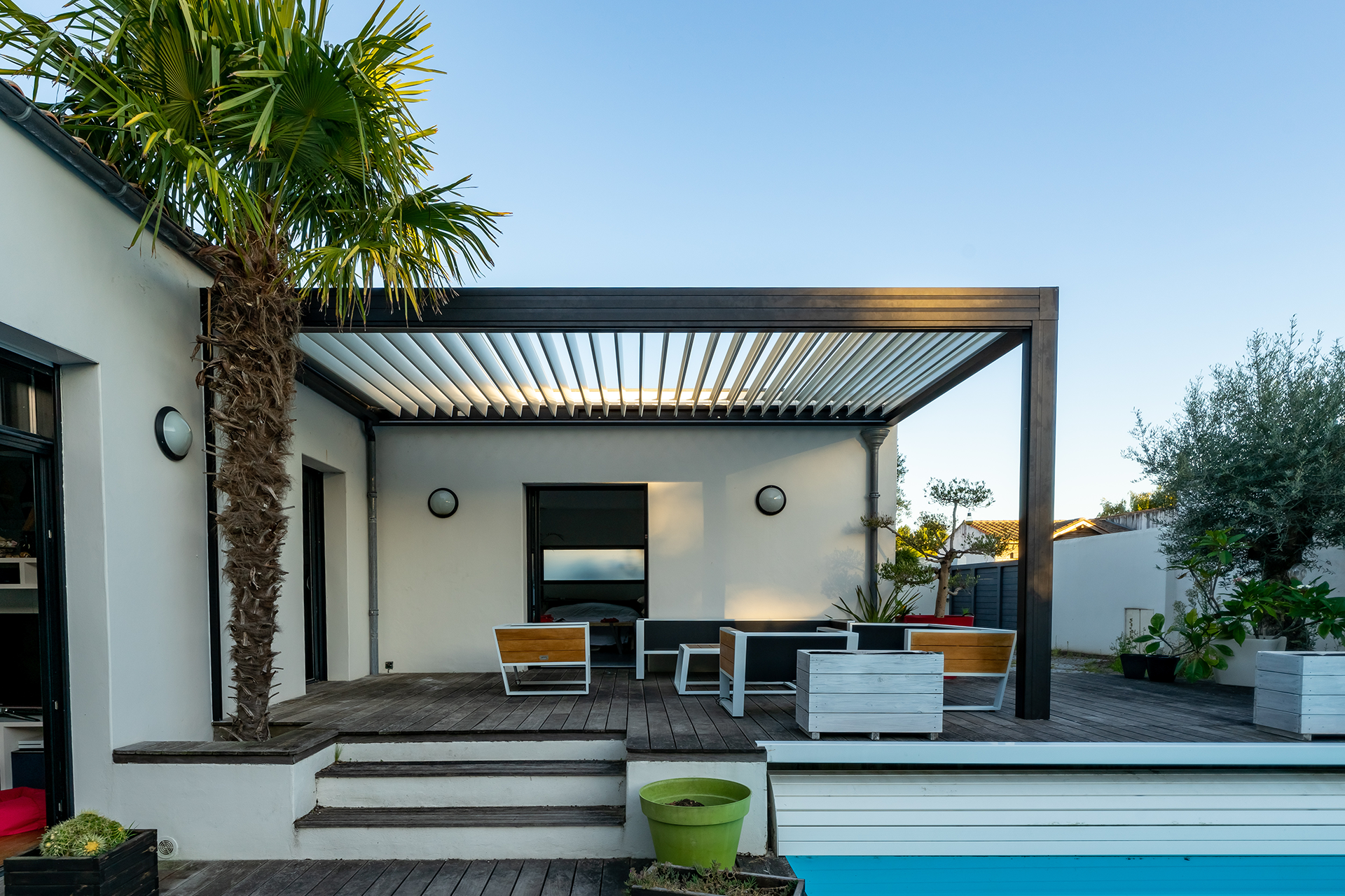 Sunroom or enclosed patio with large windows and clean transitions to the home